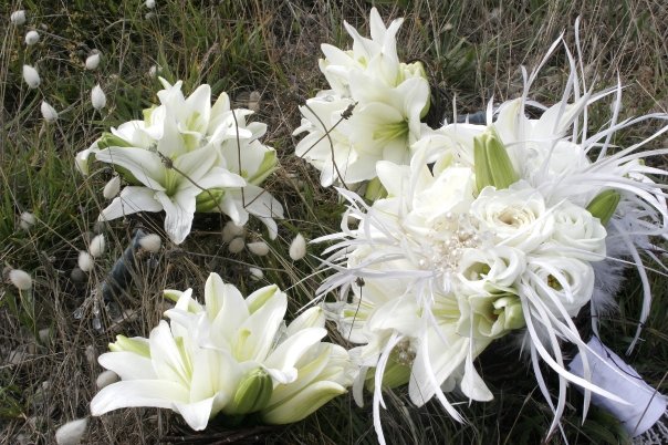 The maids' bouquets are white asiatic lilies with crystals